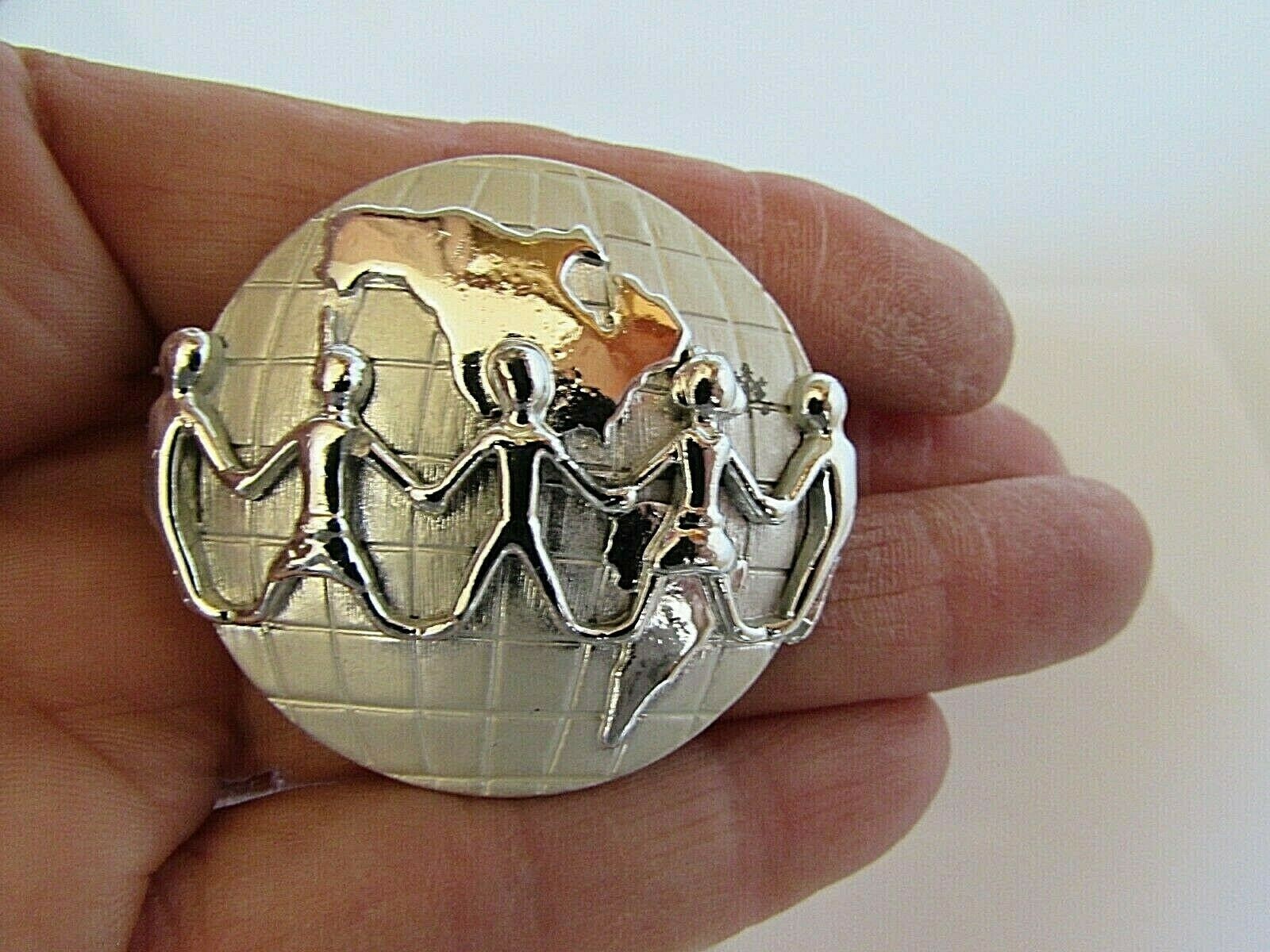 Vintage AJC Signed Silver Tone Holding Hands Across the World Brooch Pin 1 1/2″