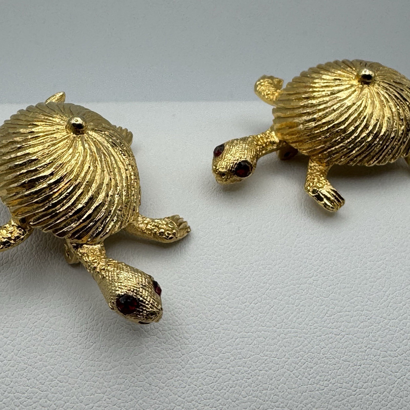 Goldtone Textured Twin Turtle Brooches Red Rhinestone Eyes