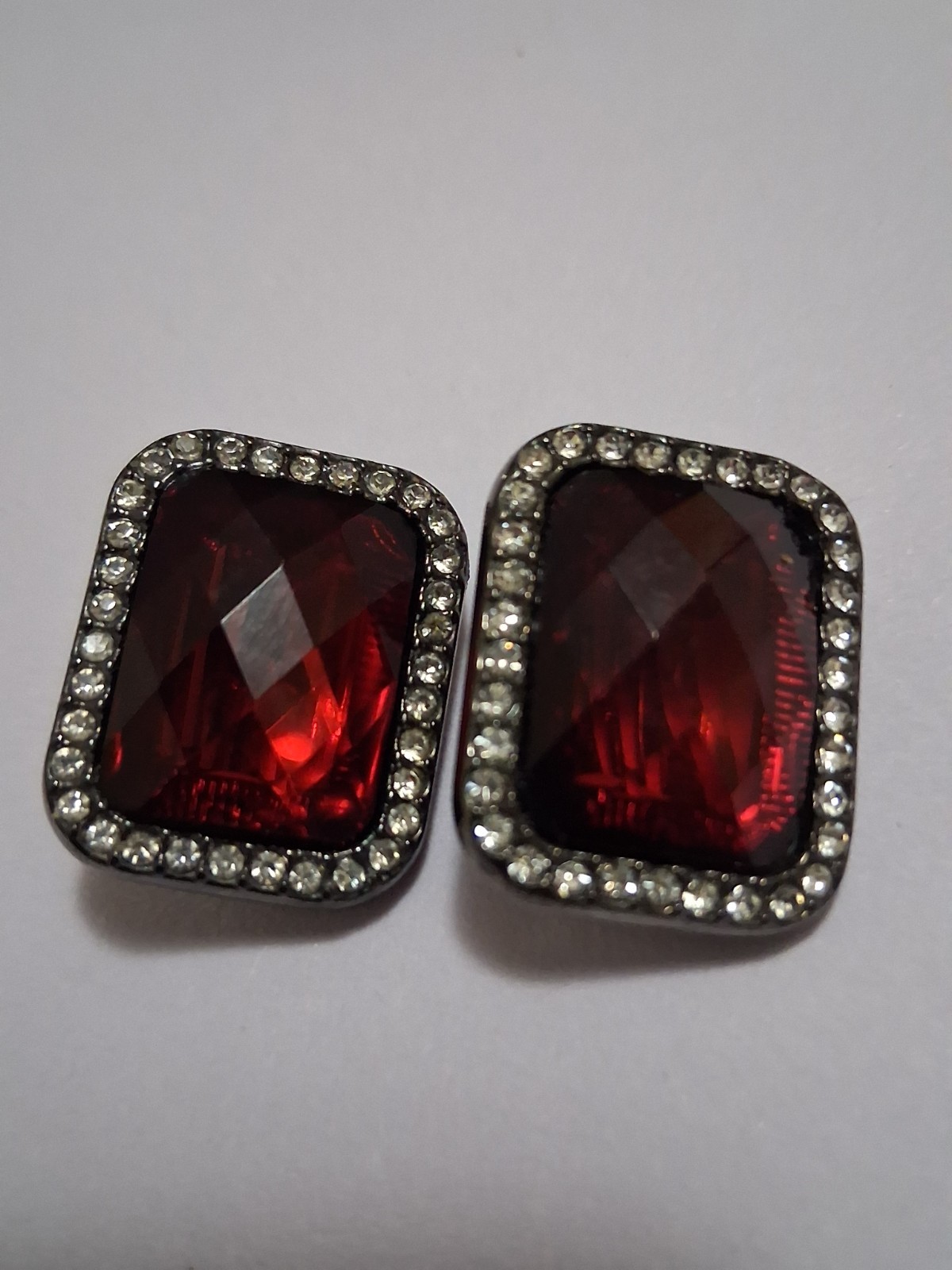 Red faceted acrylic rectangle clip on halo earrings, clear rhinestone border