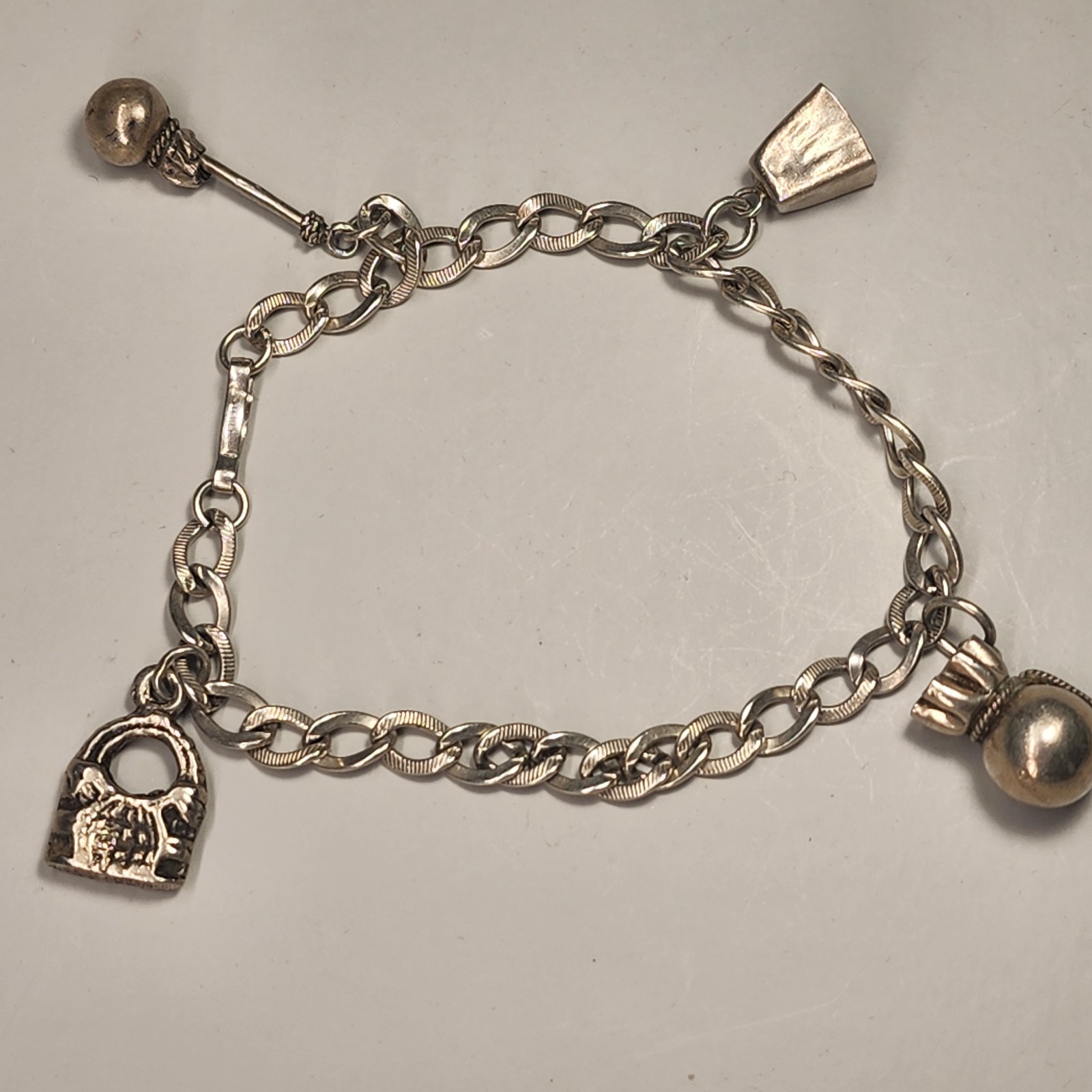 Sterling Silver Bracelet Charm Bracelet 14 Gms 7-1/2″ Long Four Silver Charms