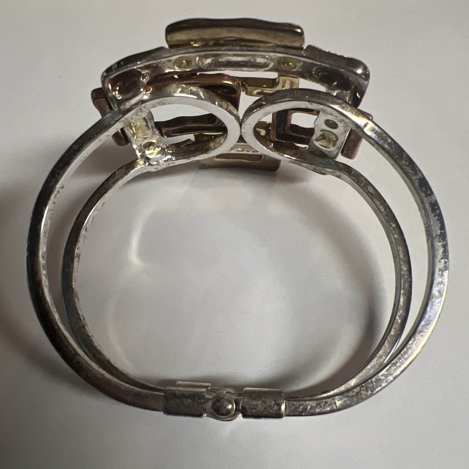 Brutalist mixed metal cuff bracelet, geometric silver and gold tone squares.
