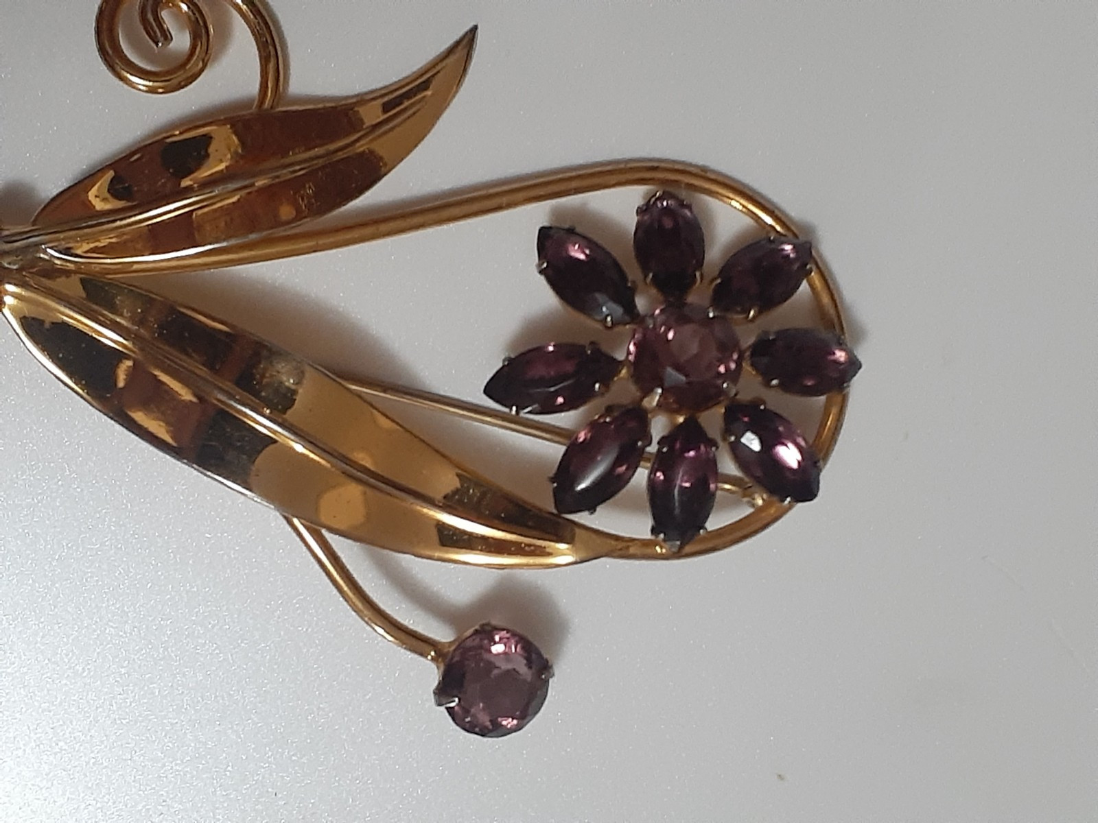 Sterling silver gold plated prong set purple glass flower & stem leaf brooch