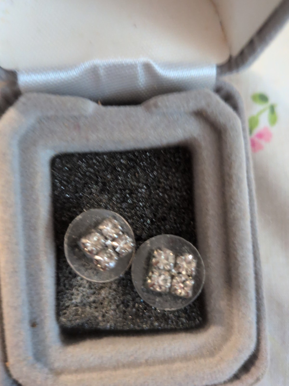 Earrings are rhinestone cluster earrings – silver-tone base.