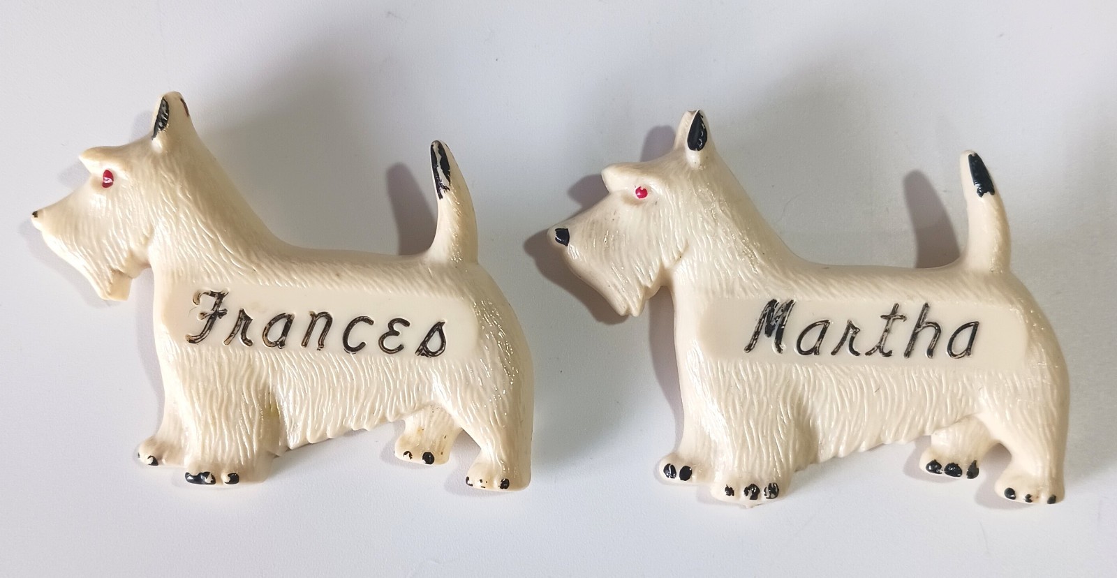 Pair of Vintage Off-White Celluloid Westie Dog Brooches: Frances & Martha