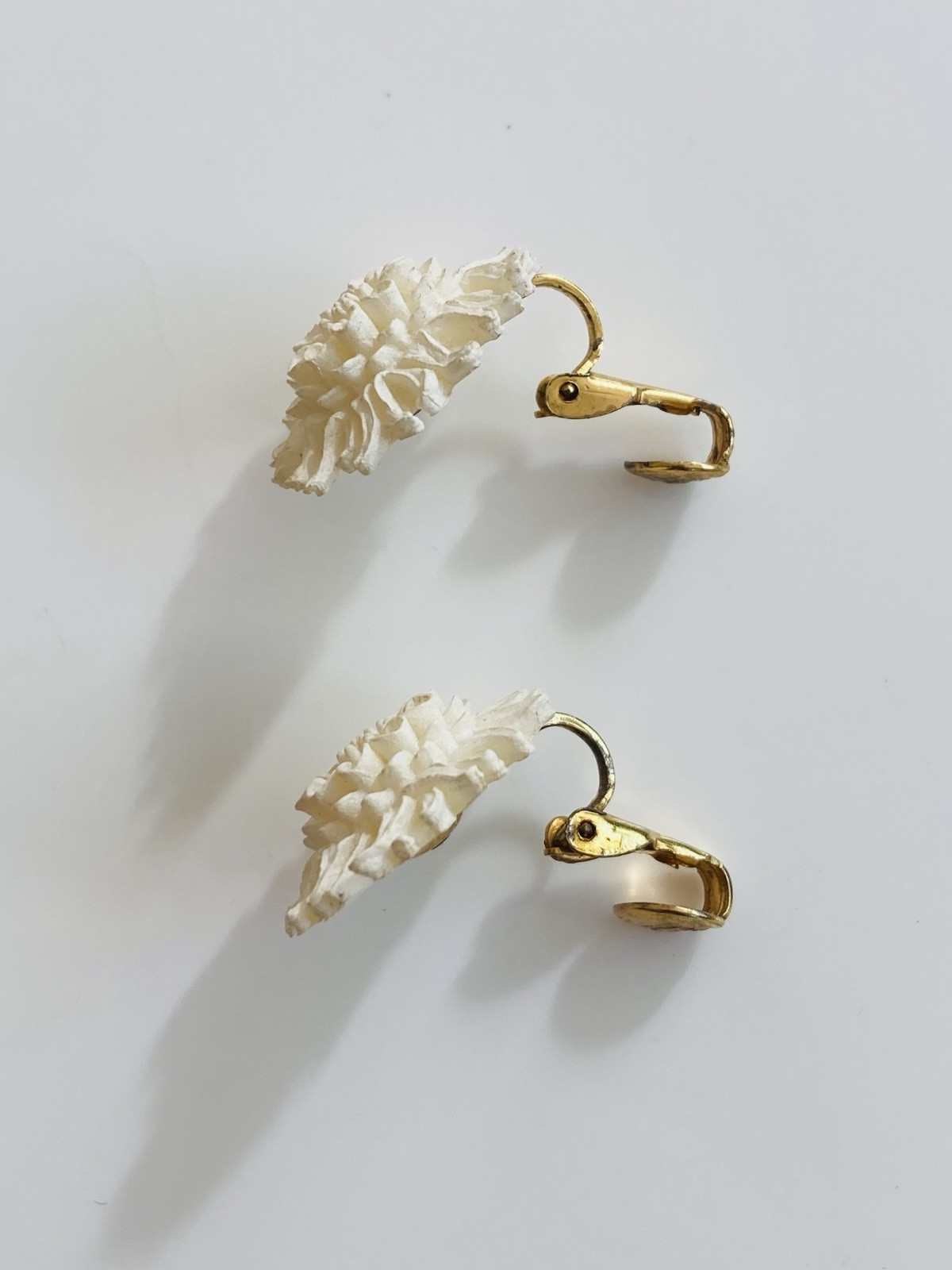 Vintage mid century MCM white celluloid floral clip on earrings