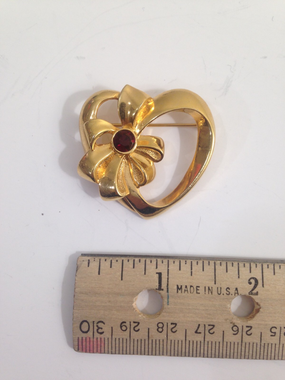 3 brooches – 1 Avon heart w/bow , 1 Pisatelli swoop, 1 unbranded scotty dog lot