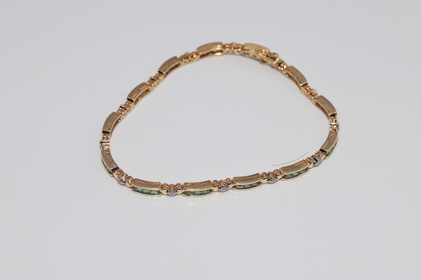Vintage Circa 1980s 18k Gold Natural Diamond And Caliber Cut Emerald Bracelet