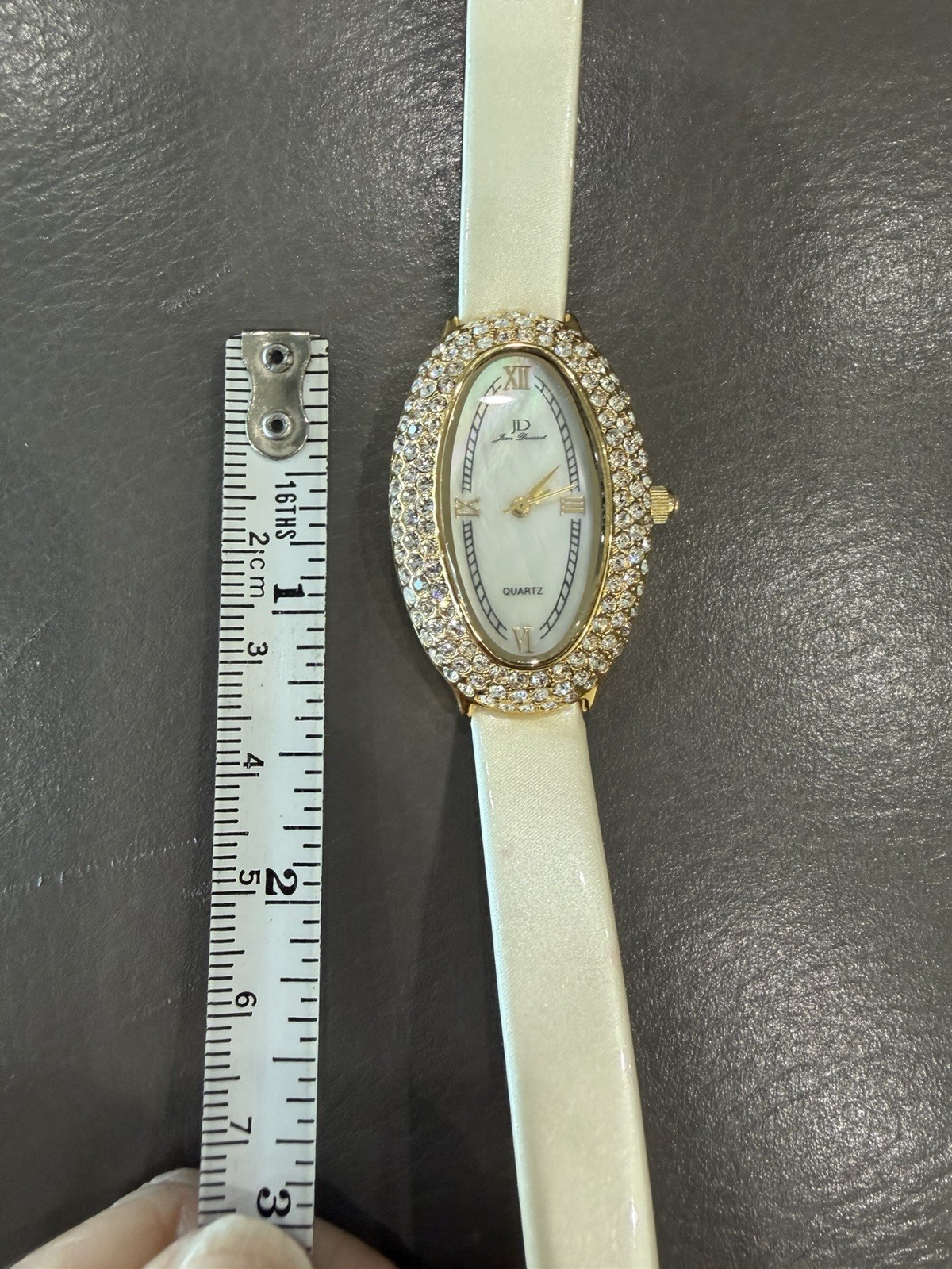 Vintage Jean Dousset Leather, Rhinestone Watch With Beige oval face.