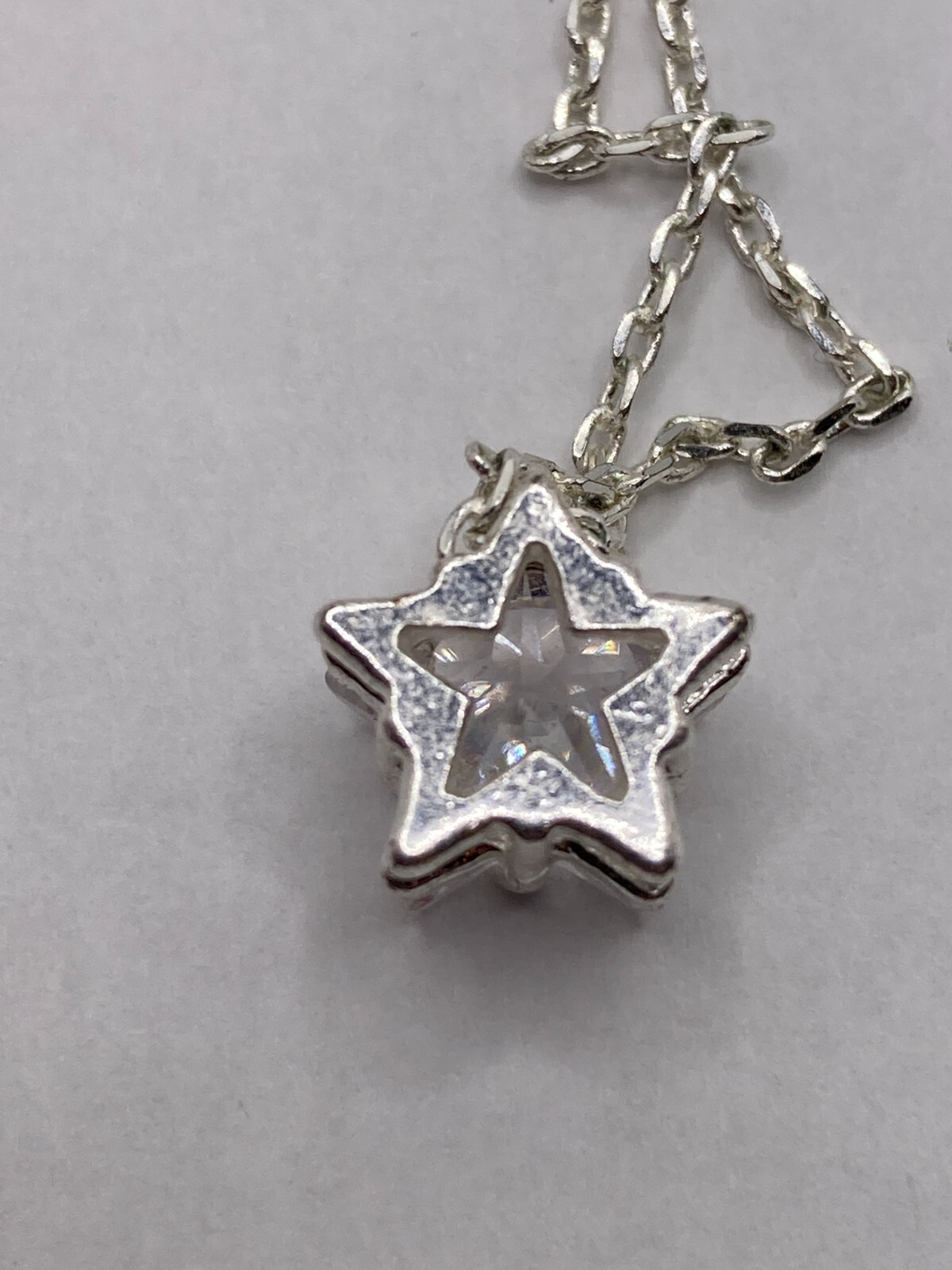 Shimmering Star-Shaped Clear Stone on Delicate Silvertone Necklace