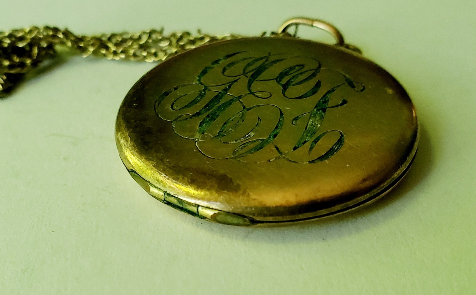 Antique gold tone etched/monogrammed locket pendant necklace stamped F.L.S.