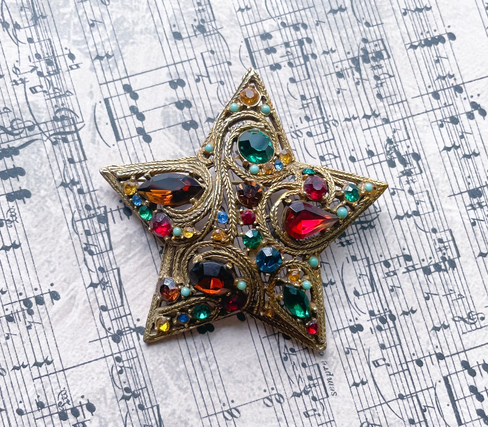 Vintage La Roca Gold Alloy Multicolor Rhinestone Star Brooch