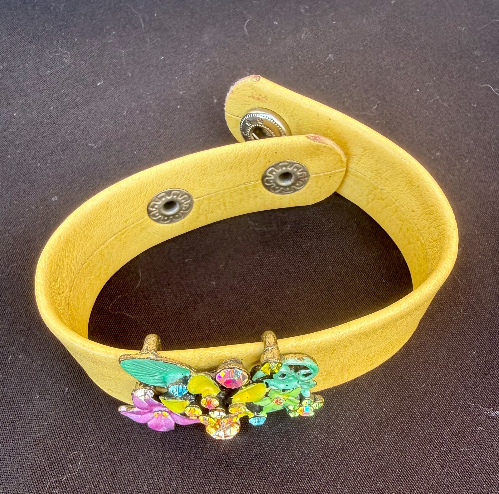 Vintage Yellow Leather Snap Cuff Band with enamel and rhinestone floral cluster