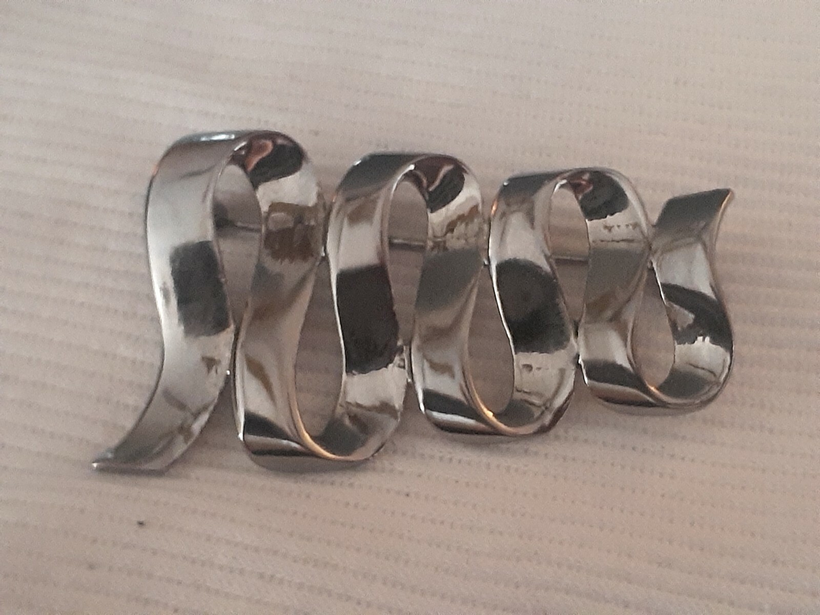 Vintage M Jent polished silvertone Swirl ribbon design Brooch/pin