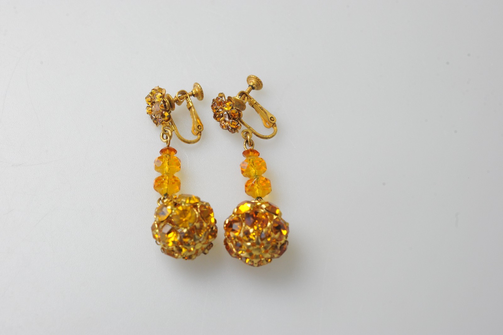 Vtg signed Miriam Haskell rhinestone Gold Tone drop clip earrings amber color