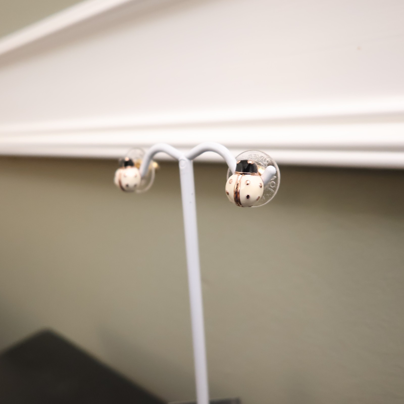 Joan Rivers earrings ladybugs white black enamel signed rose goldtone studs