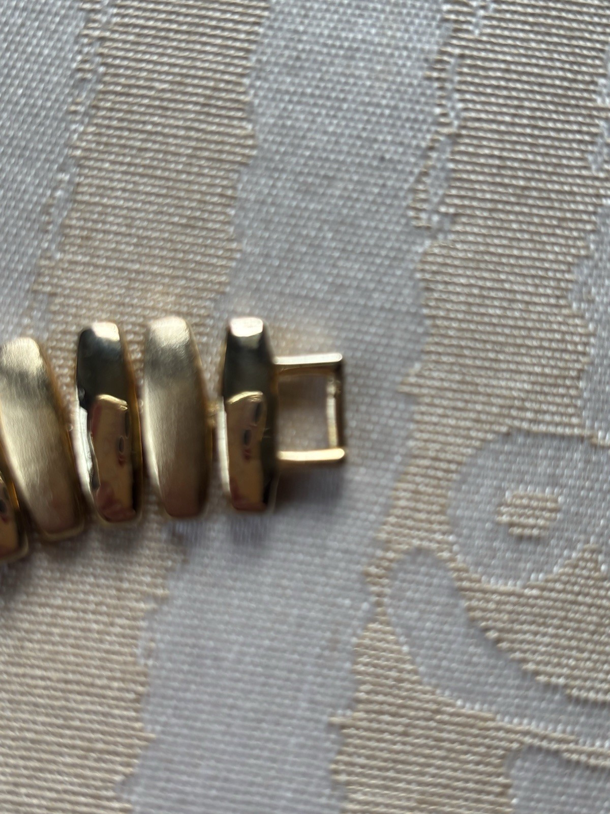 Vintage Napier gold-tone link bracelet featuring articulated, curved links 6.5”