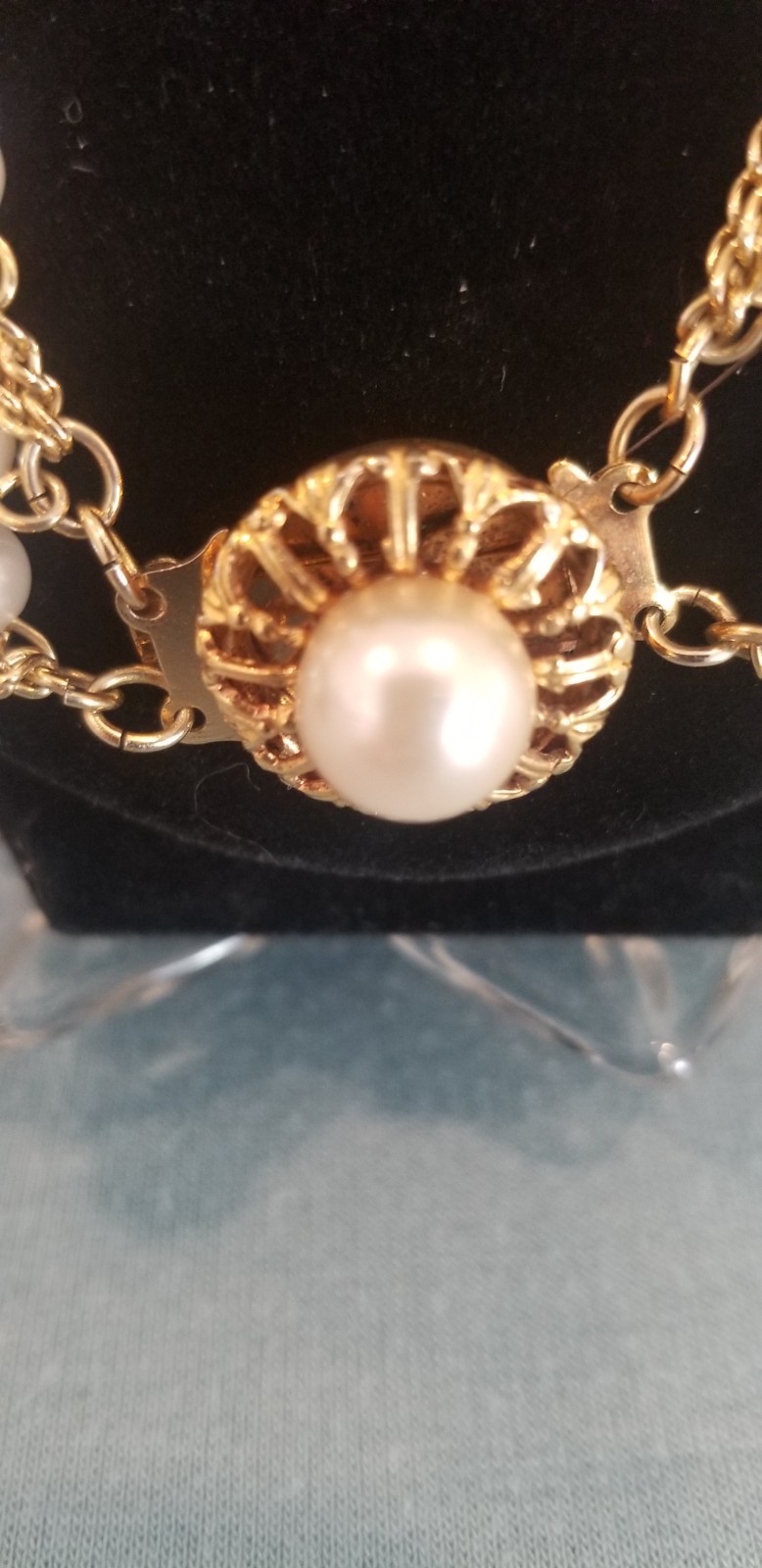 Vintage Faux Pearl And Gold Tone 4 Strand Necklace With Decorative Clasp.