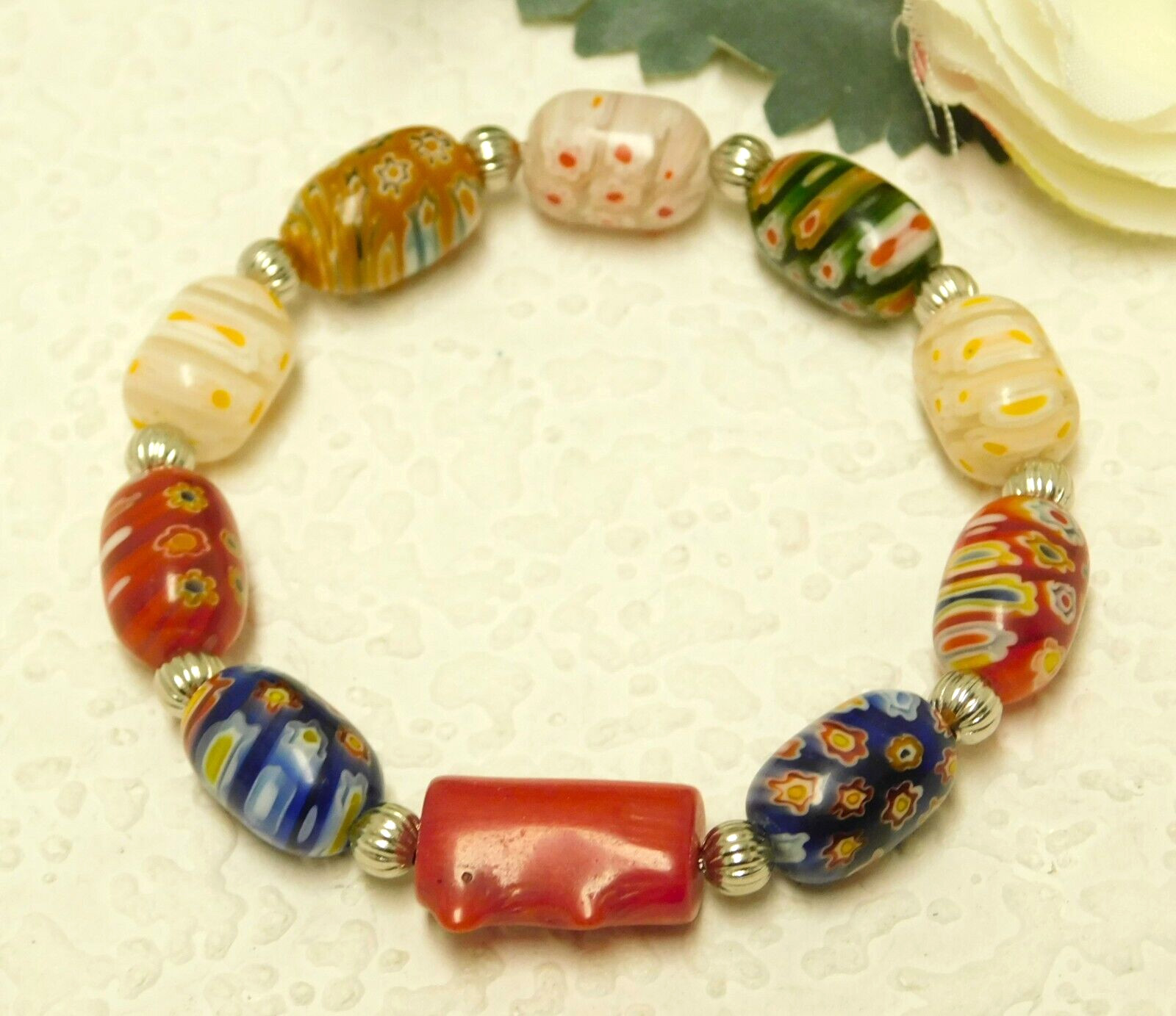 RED CORAL, GLASS MILLEFIORI BARREL BEAD SILVER TONE ACCENTED STRETCH BRACELET