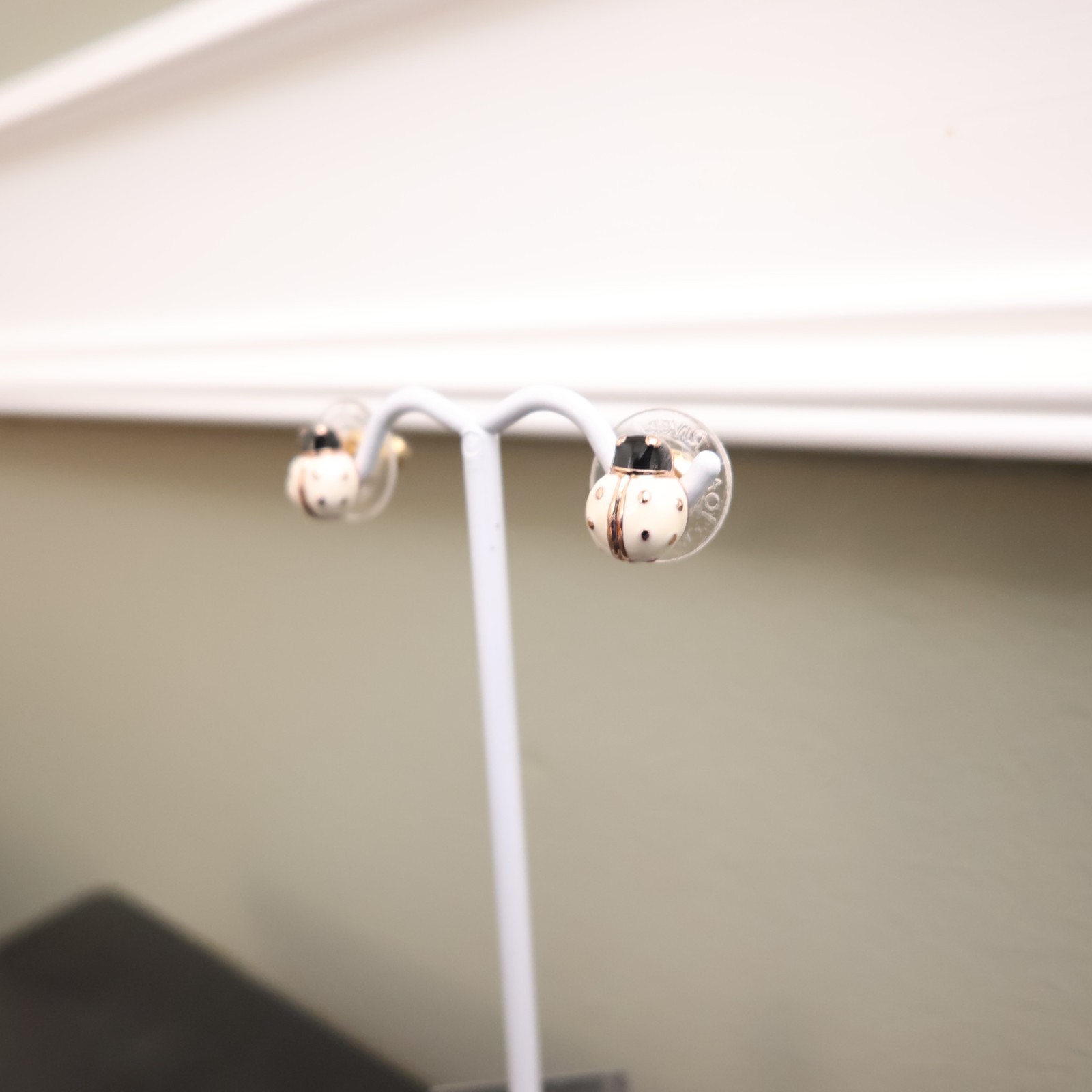 Joan Rivers earrings ladybugs white black enamel signed rose goldtone studs