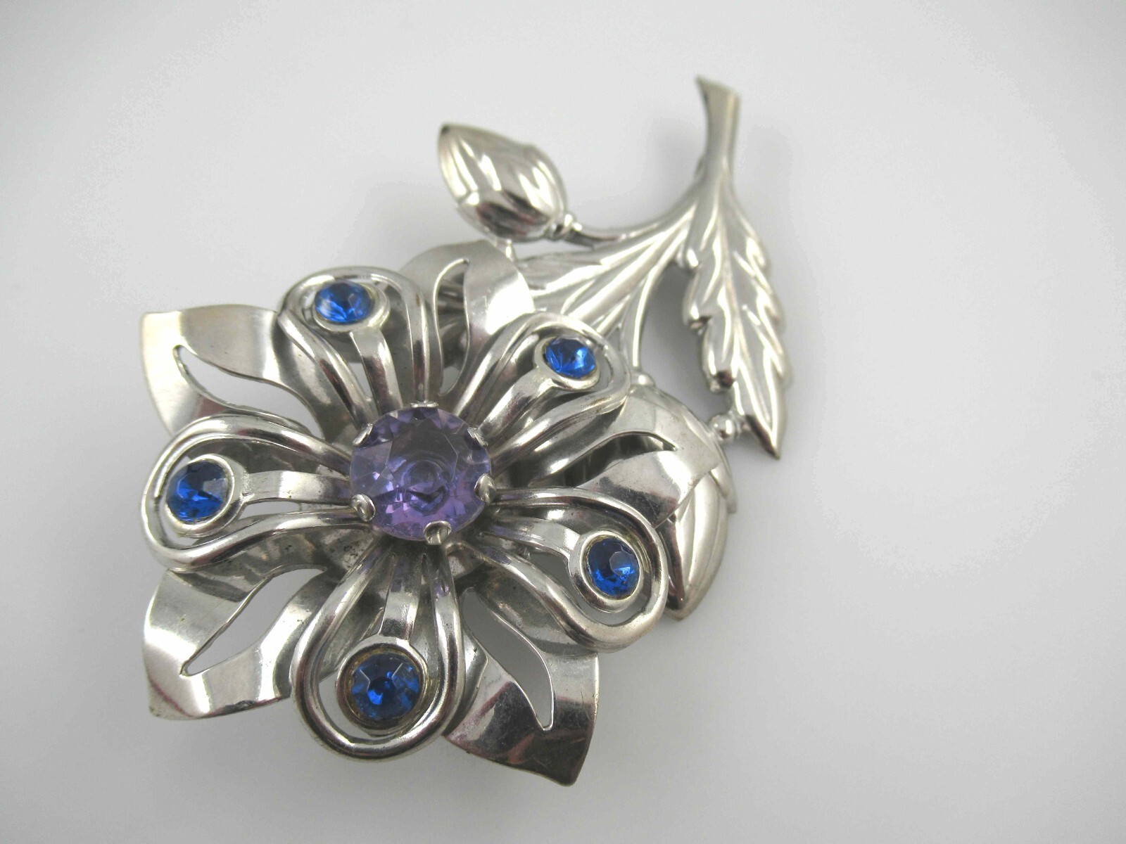 Vintage Purple/Blue Rhinestone on Silver Tone Stamped Metal Flower Brooch, Pin