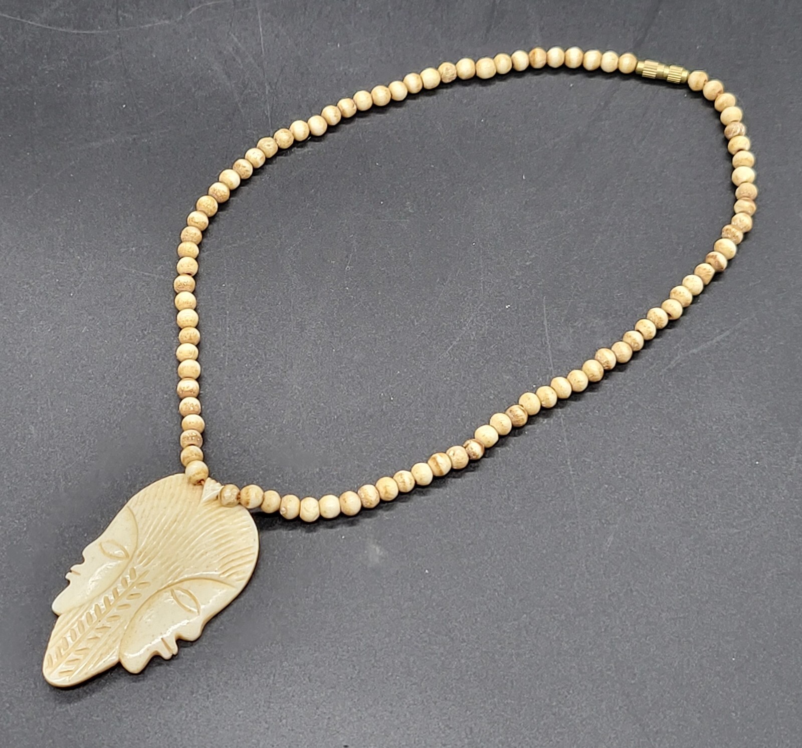 vintage 18″ bovine bone beaded necklace with double face pendant, barrel clasp