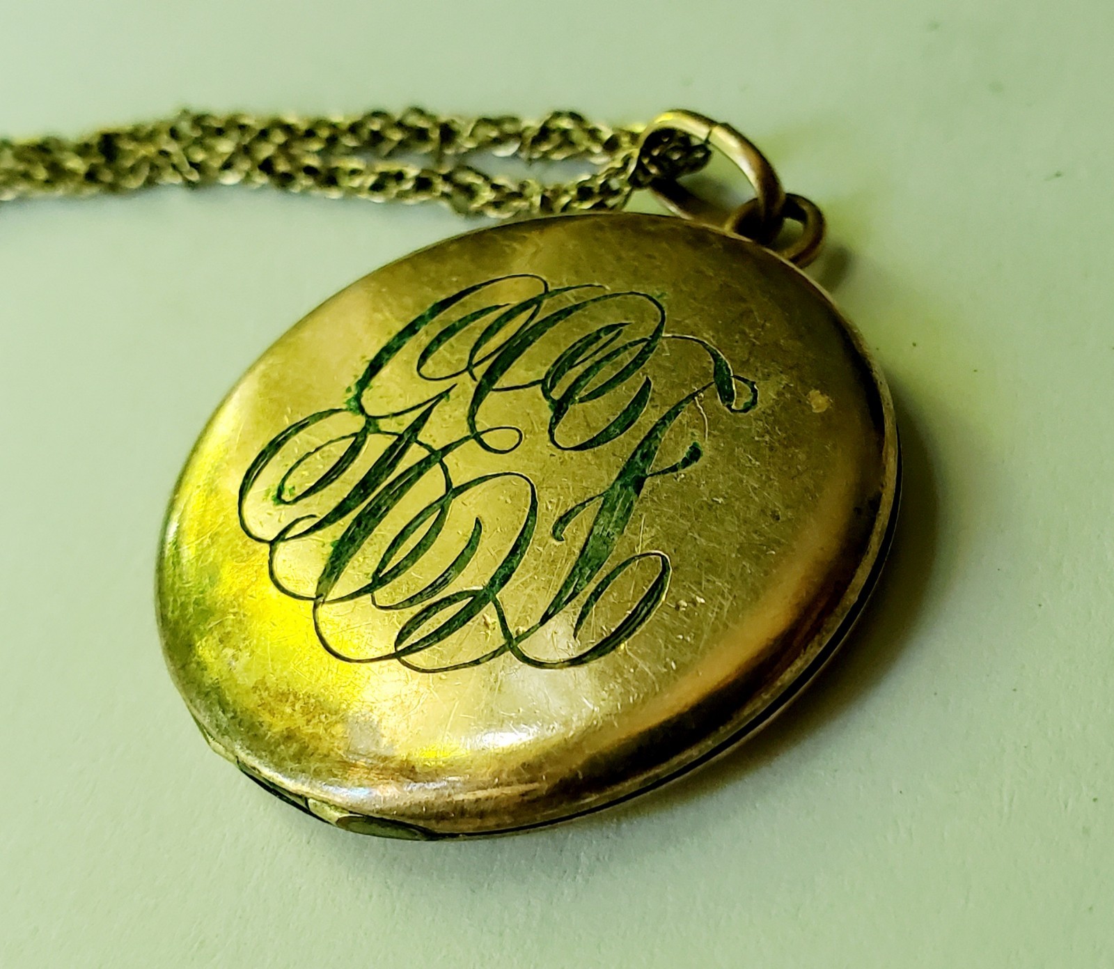 Antique gold tone etched/monogrammed locket pendant necklace stamped F.L.S.