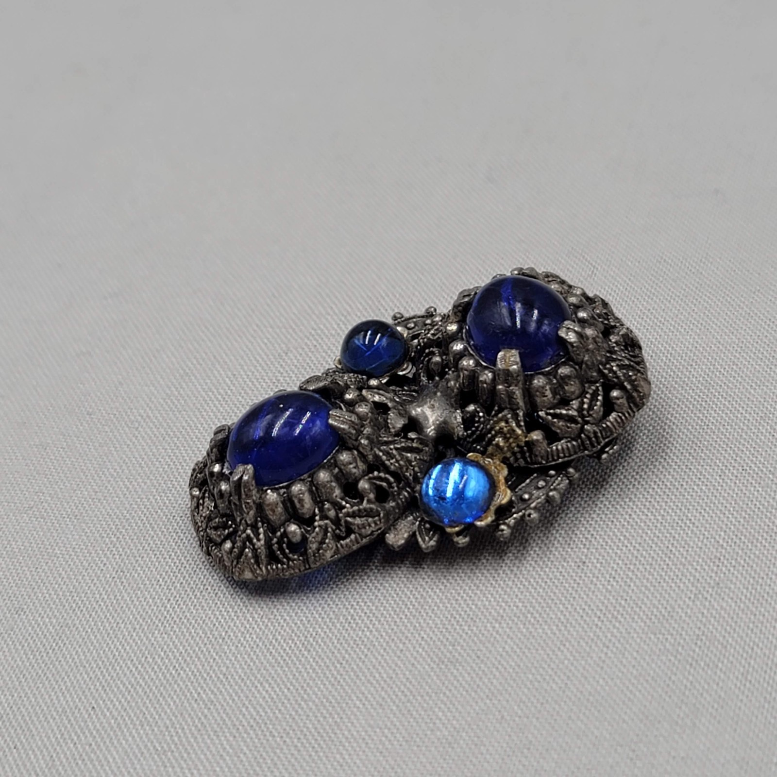 Vintage Blue Cabochon Dress Clip Dark Gray Embossed 2″