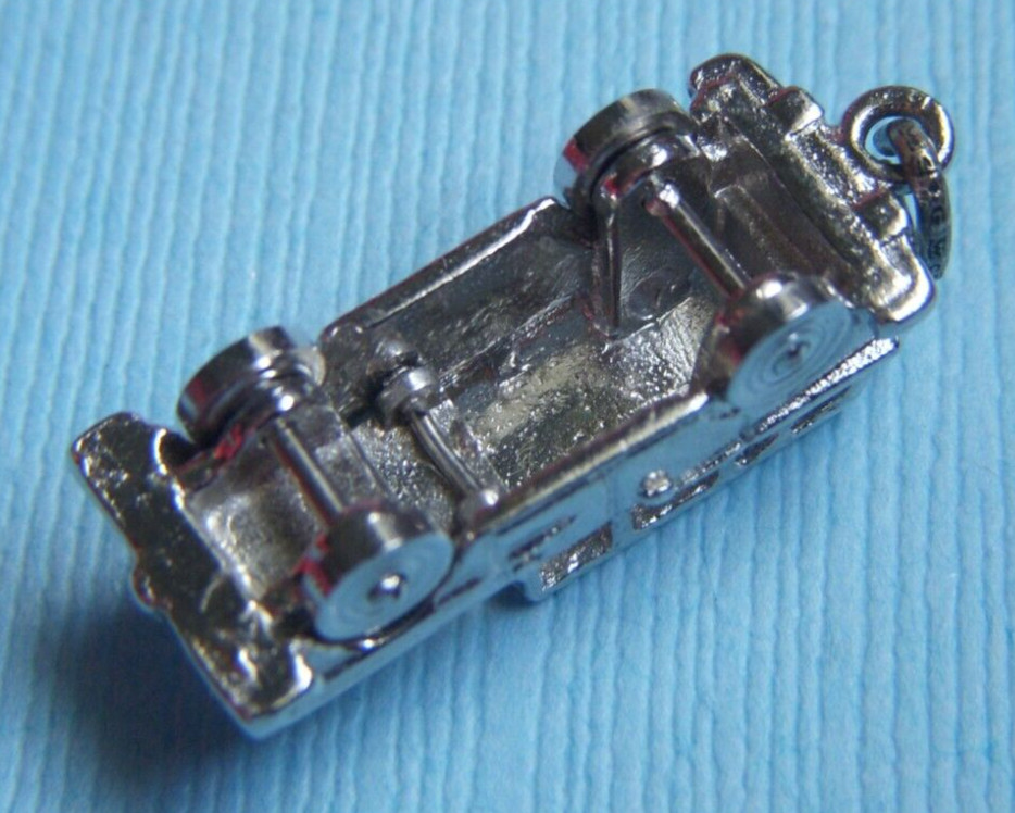 Vintage movable station wagon wheels move sterling charm