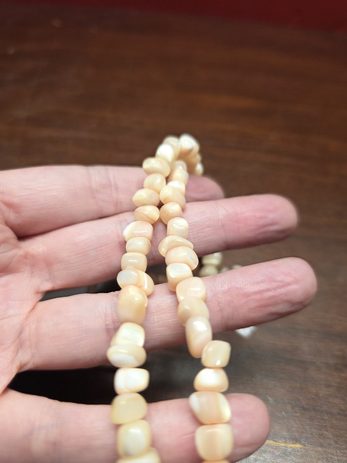 Vintage Coral necklace made of beads and carved shell leaves Gorgeous