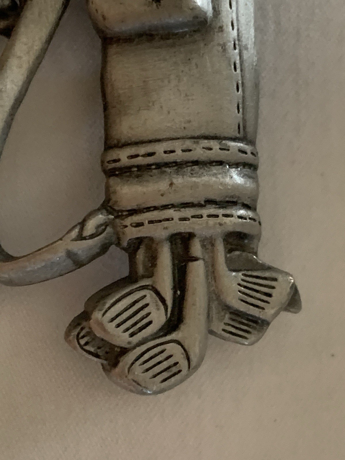 Jonette Jewelry (JJ) golf-themed brooch made of pewter or a similar alloy