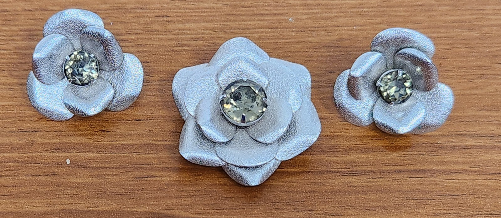 Stunning Silvertone and Rhinestone Flower Clip Earrings And Brooch