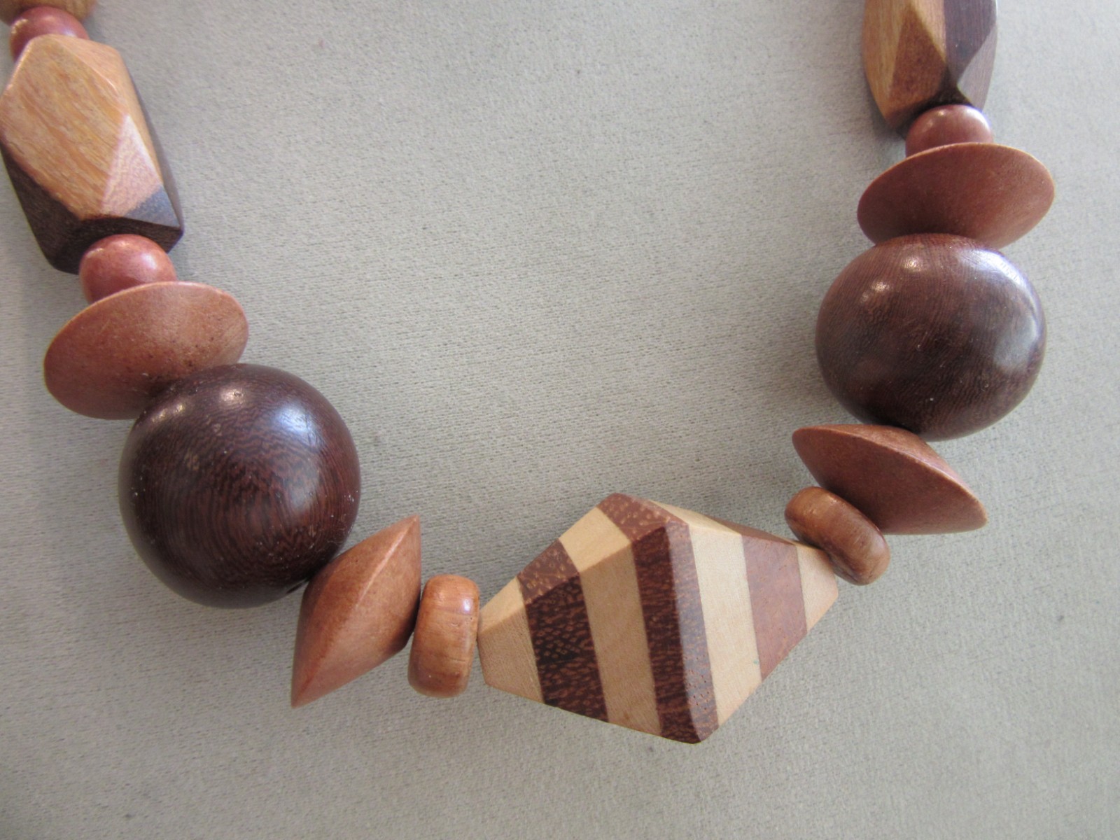 Vintage polished and faceted wood beaded necklace -22″ long
