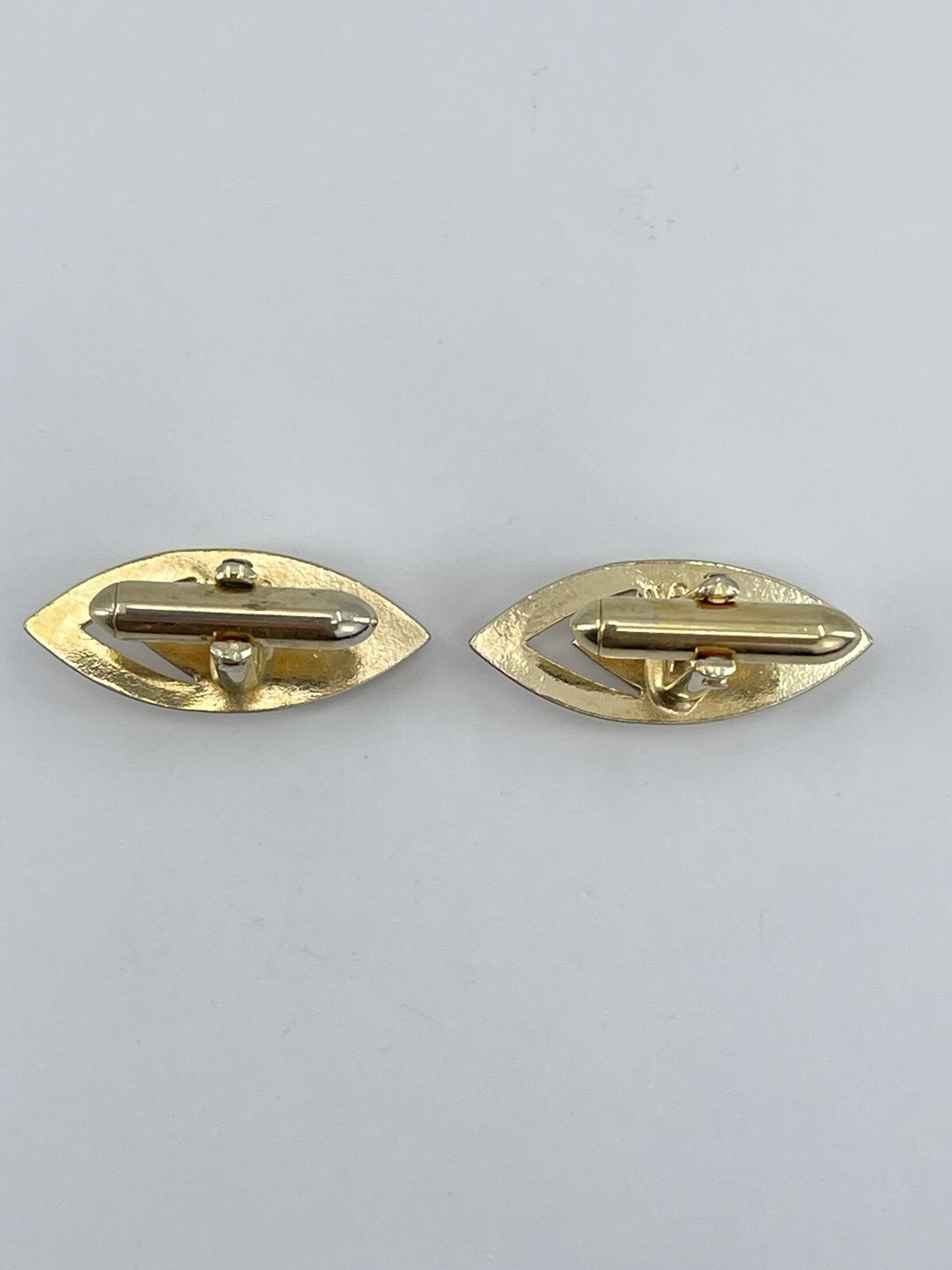 Vintage Swank mens cufflinks torpedo shaped raised cutout design gold tone 3/4″