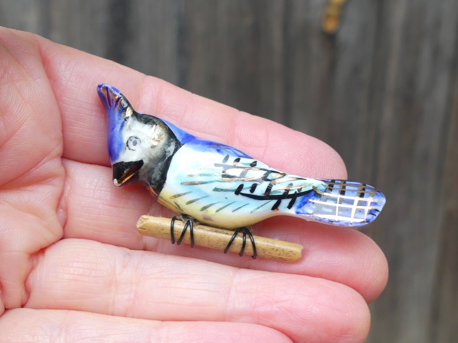 Vintage ceramic blue jay brooch on wood branch bird hand-painted gilt porcelain