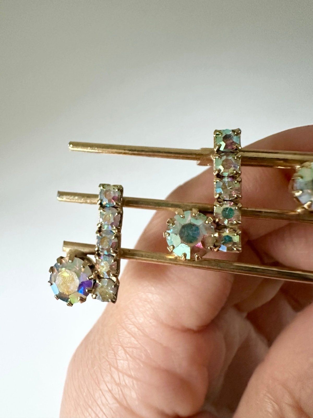 Vintage gold tone rhinestone music notes brooch