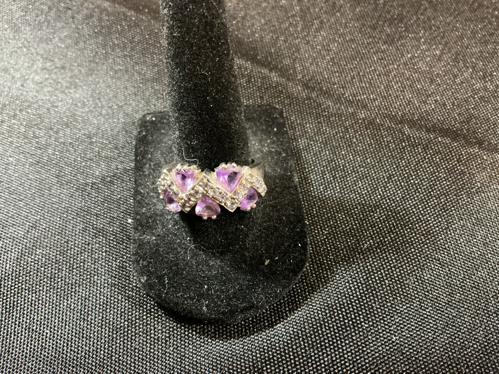 sterling silver ring features amethyst trillion-cut gemstones