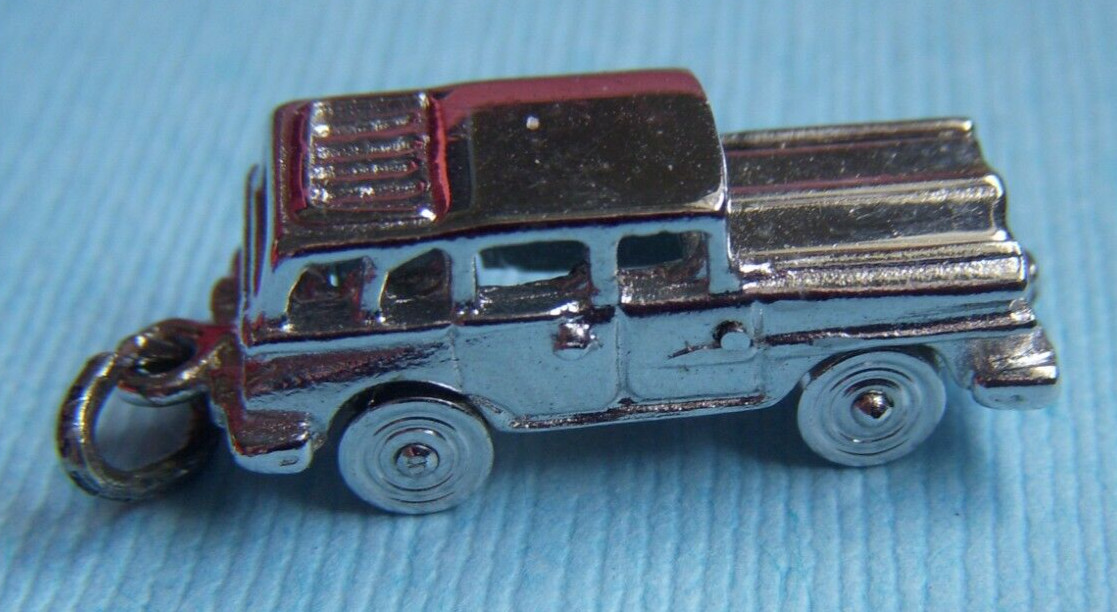 Vintage movable station wagon wheels move sterling charm