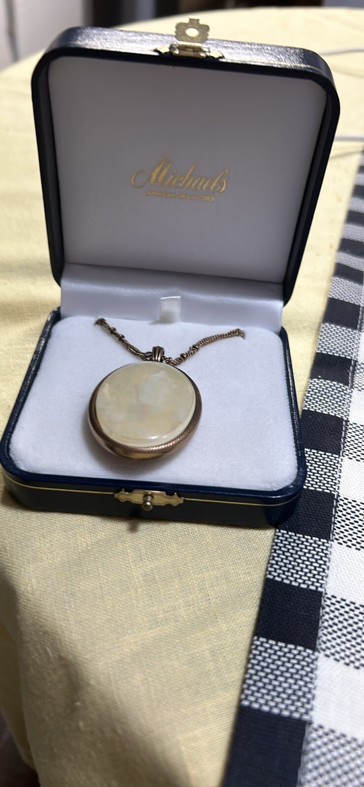 Mother of pearl necklace on one side not sure on the other side what it is