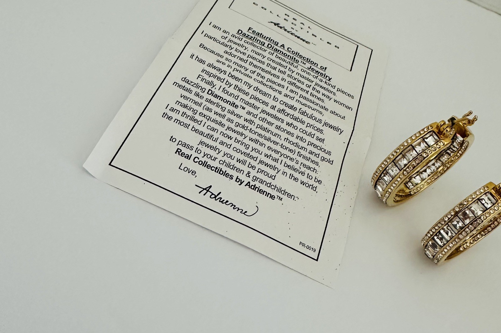 REAL COLLECTIBLES BY ADRIENNE Gold Tone Rhinestone Round Earrings 1”