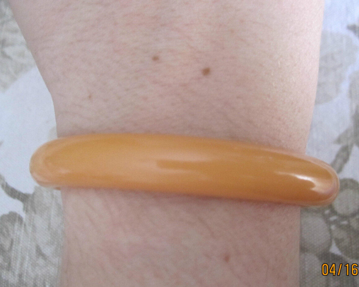 Vintage melon orange acrylic bangle bracelet, 1/2″ wide x 3″ across
