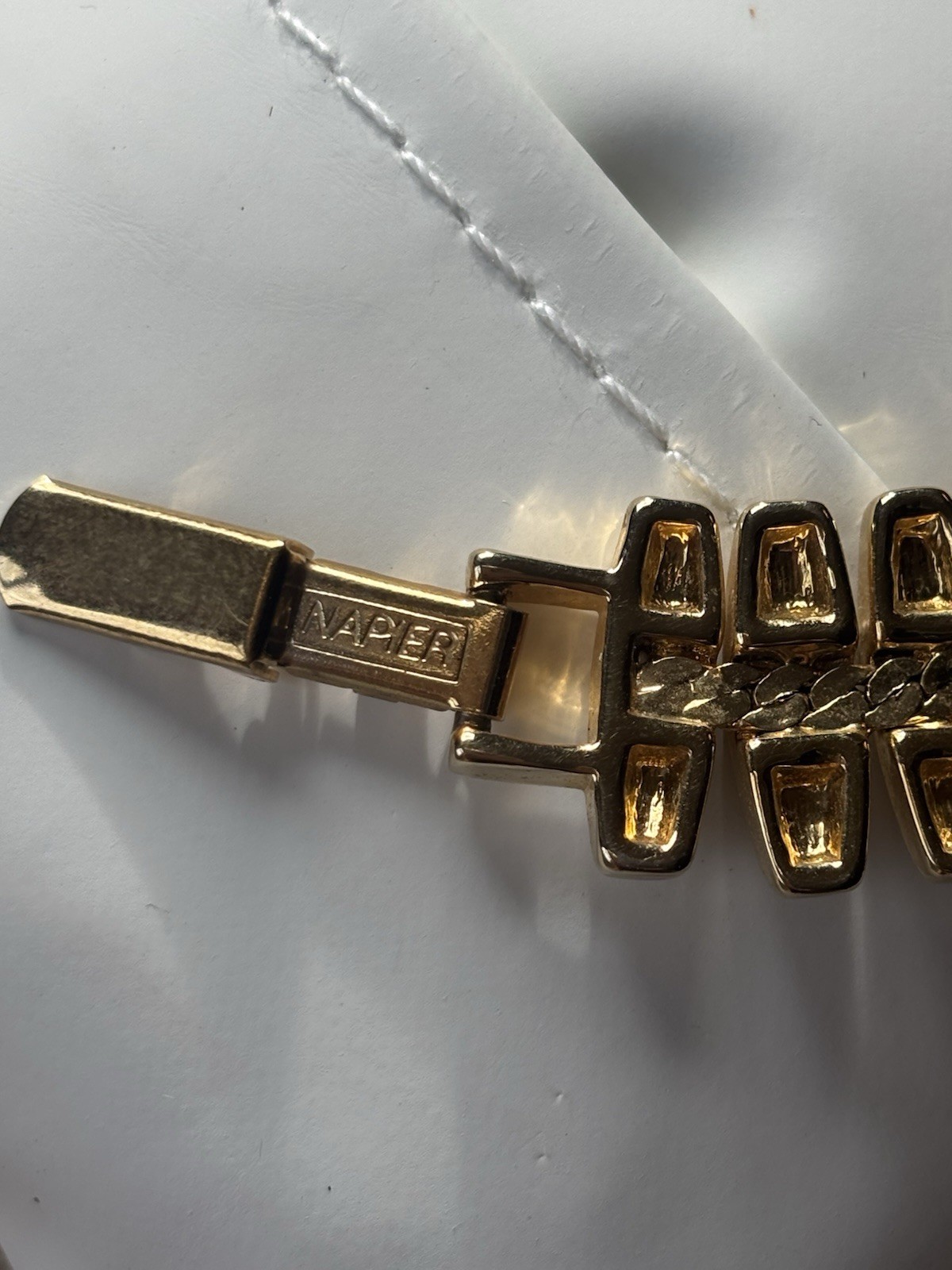 Vintage Napier gold-tone link bracelet featuring articulated, curved links 6.5”