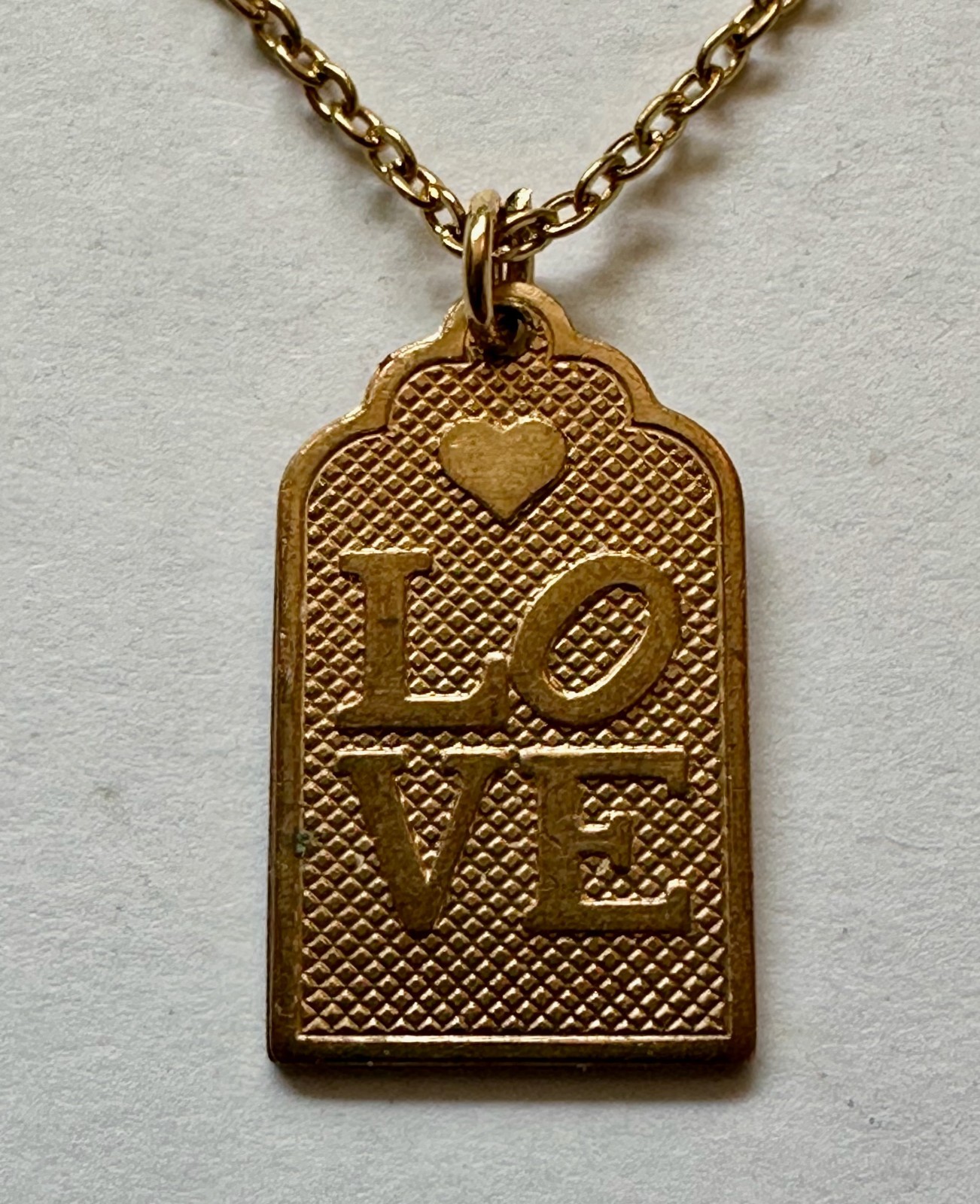 VINTAGE WORD LOVE ON RECTANGLE BRASS PENDANT 1″ NECKLACE 18″ GOLD PLATED