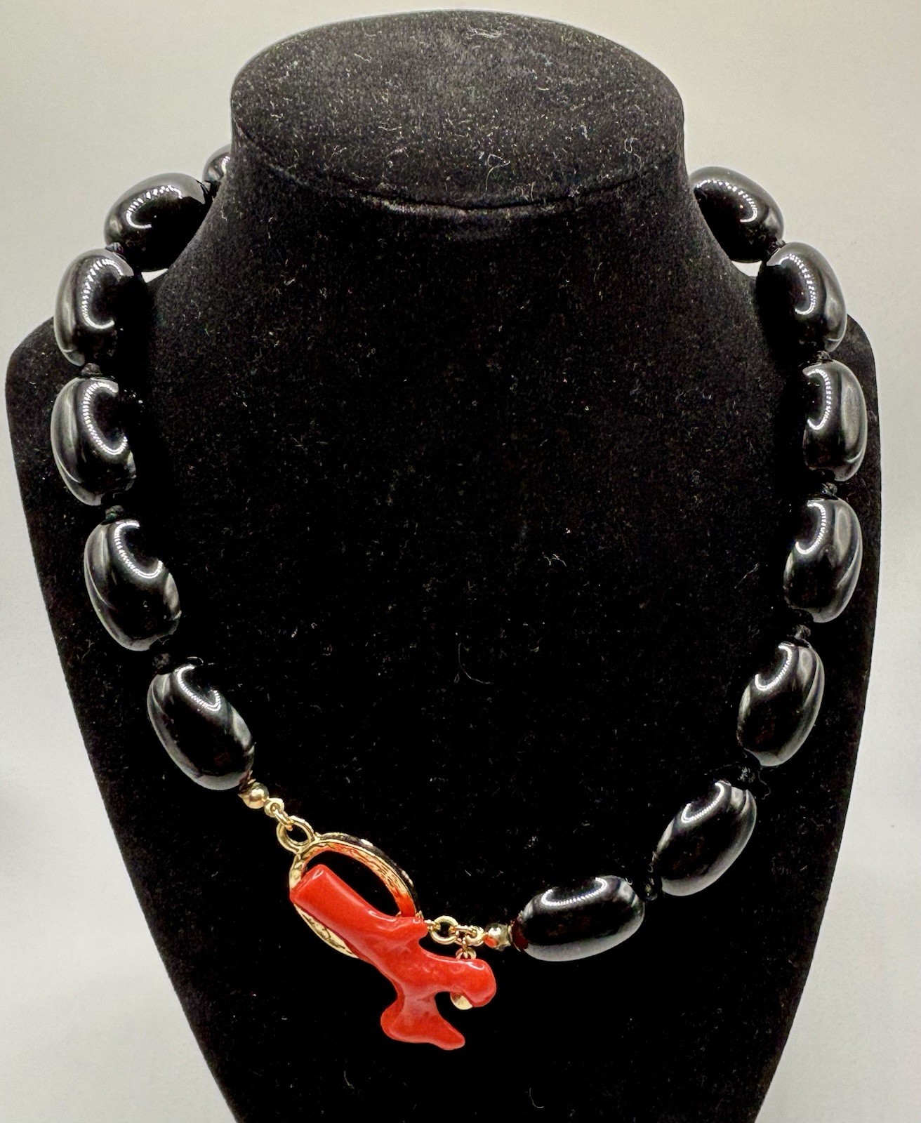 Kenneth Jay Lane ‘Andros’ necklace black lucite beads faux coral toggle closure.