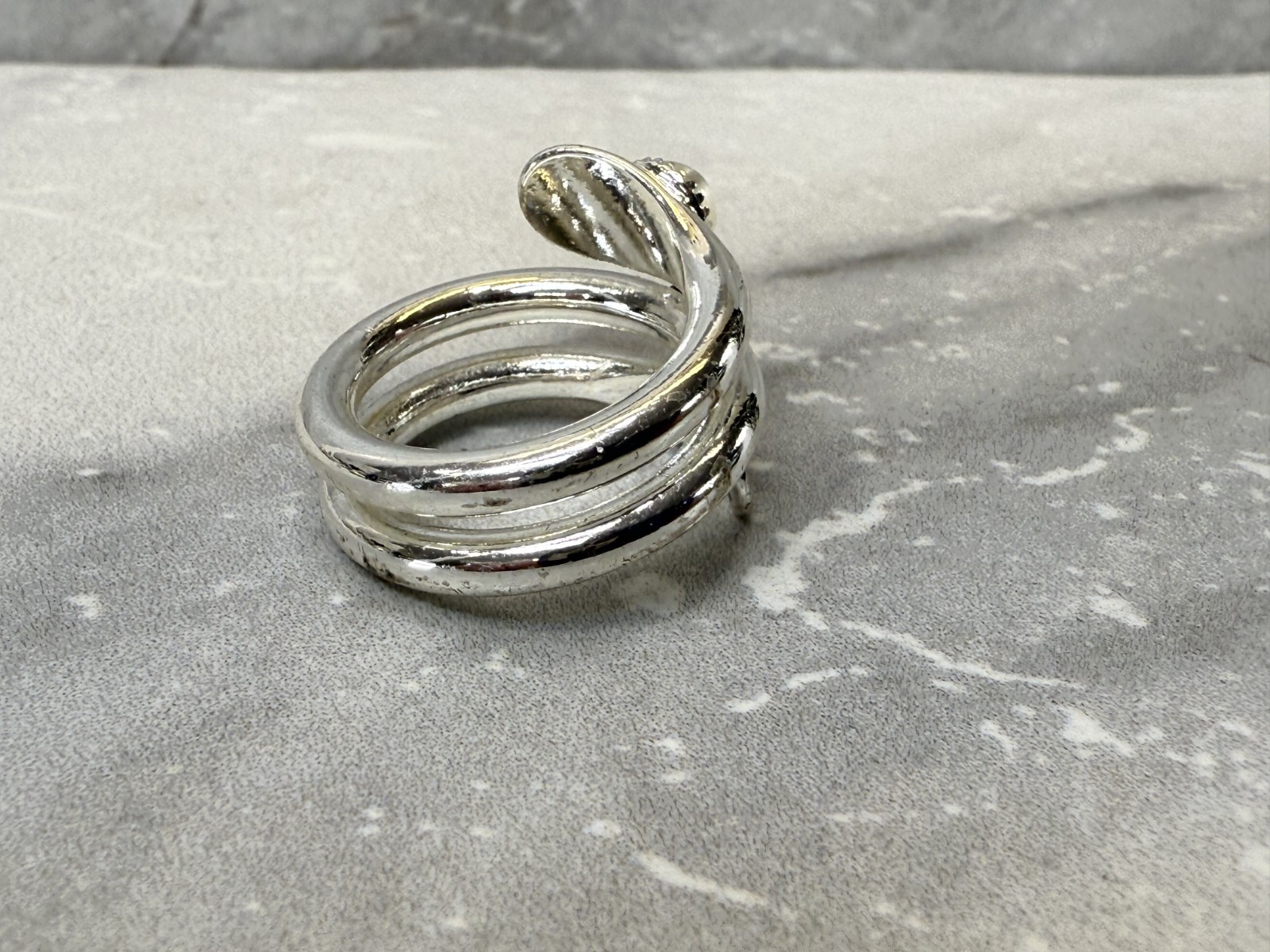 Silver tone wrap with white cat eye and righnstone ring size 6