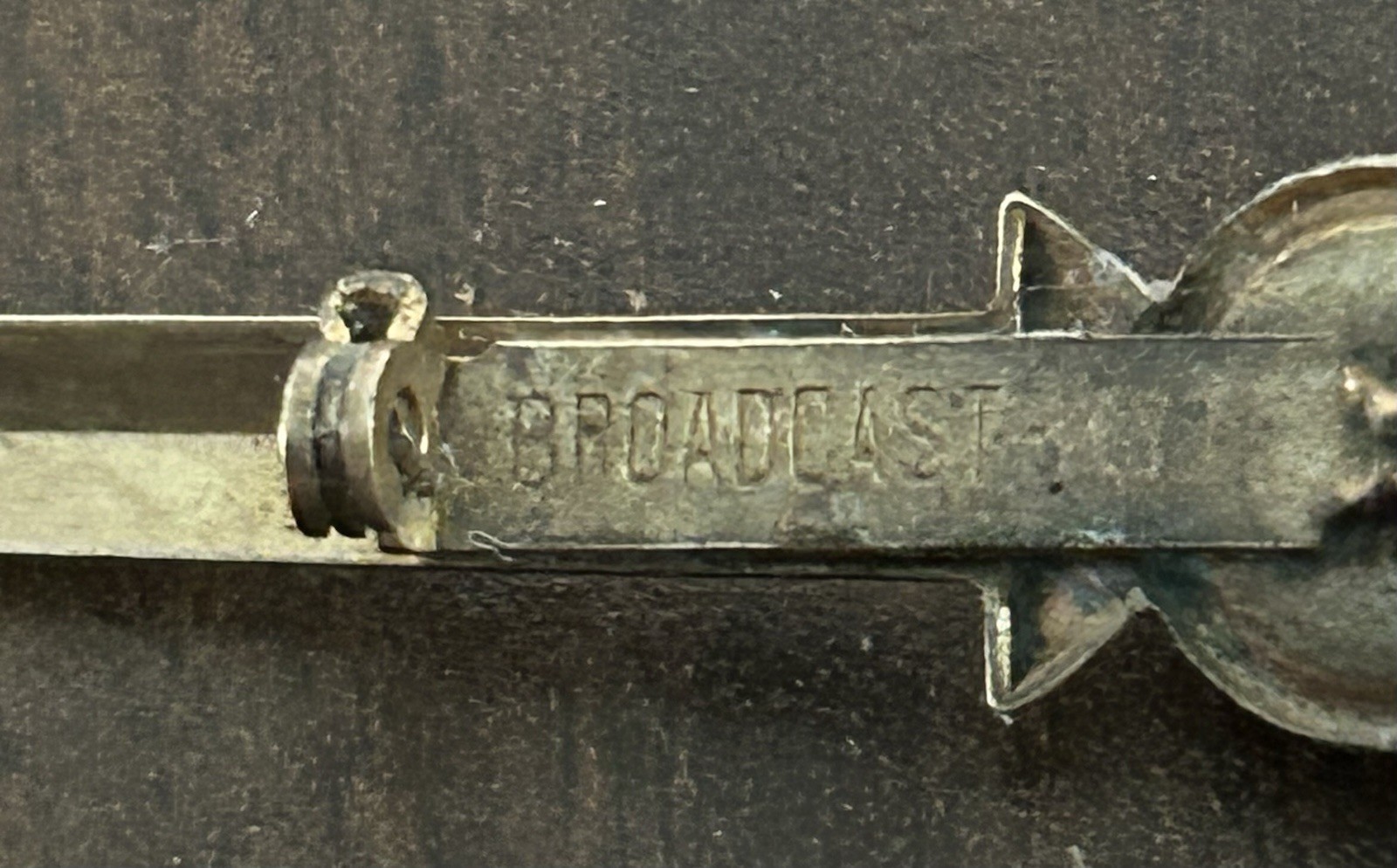Vintage Brass Tone Sword Pin Red Round Bezel Stone Signed Broadcast