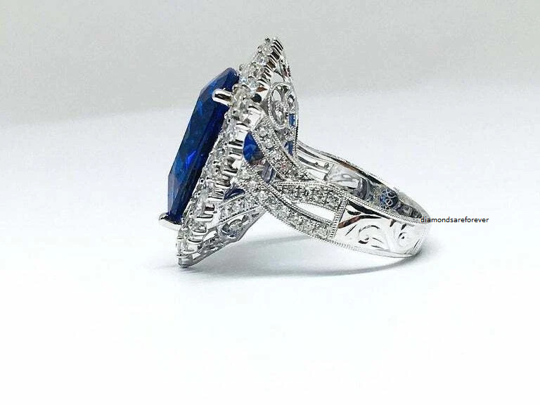 Beautiful Pear Shape 13.24CT Tanzanite & Different Shapes 3CT Shiny CZ Halo Ring