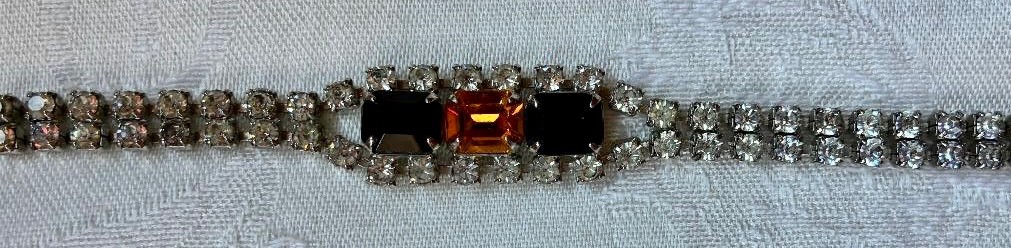 Vintage rhinestone bracelet, small clear stones,gold & black center settings
