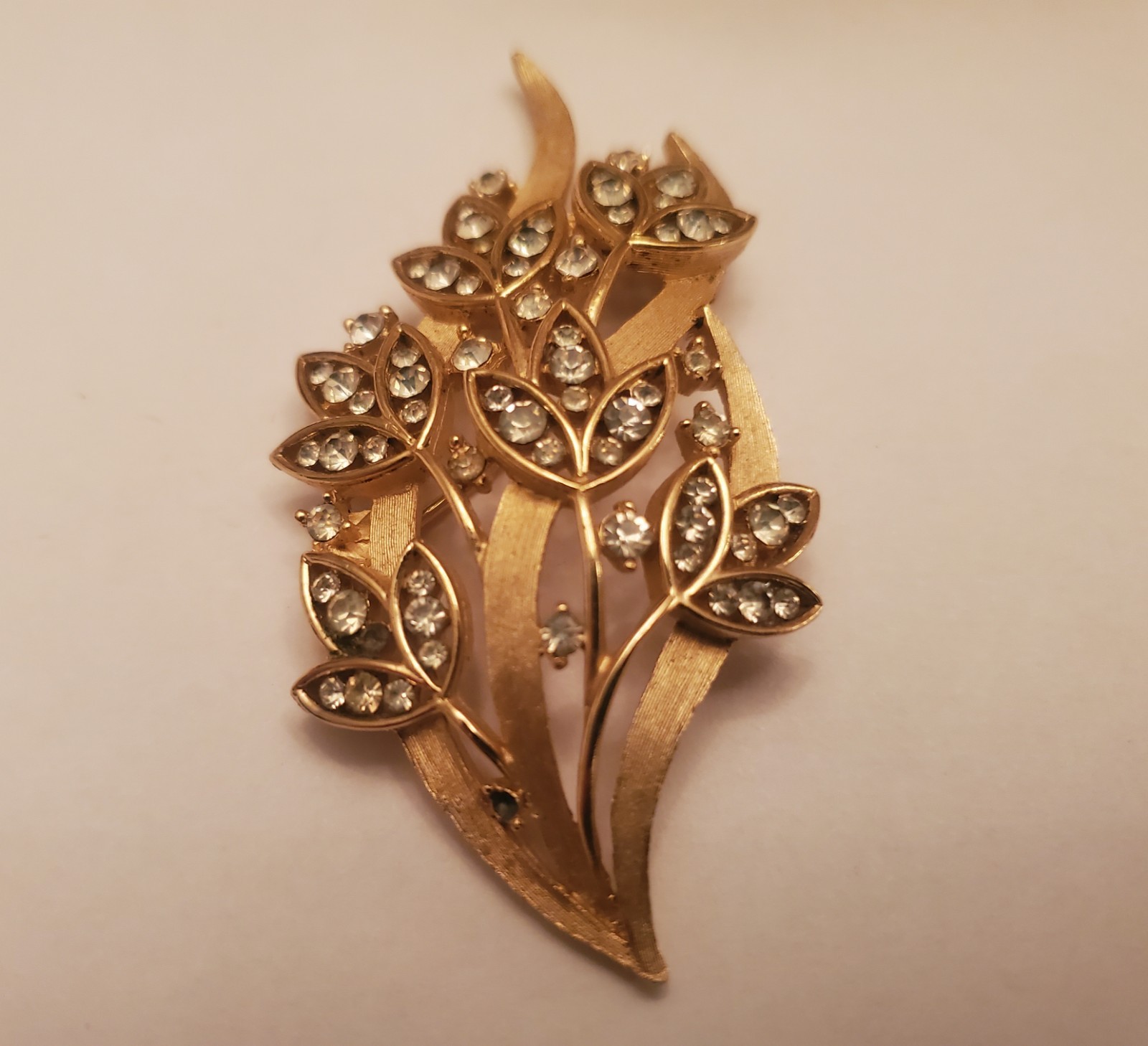 Vintage Trifari Brooch Features Floral Bouquet Design Crafted From Gold-Toned…