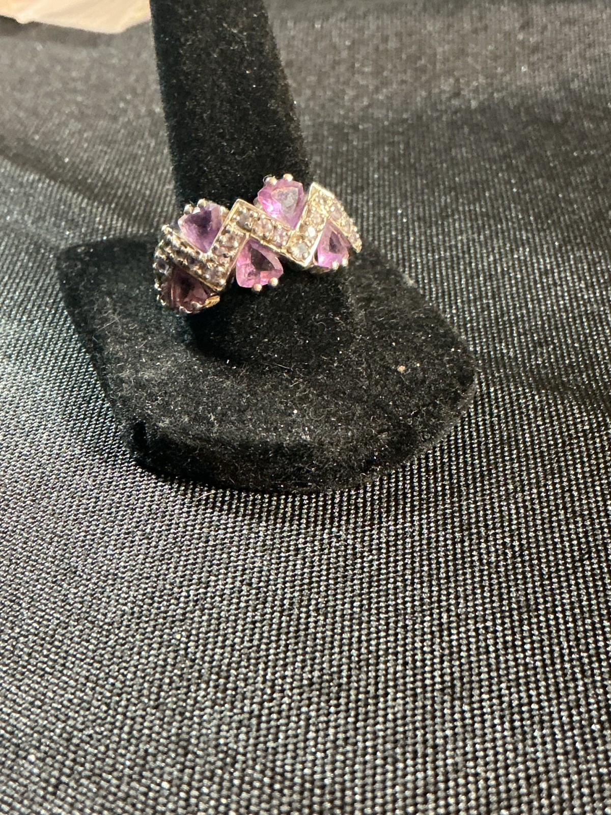 sterling silver ring features amethyst trillion-cut gemstones