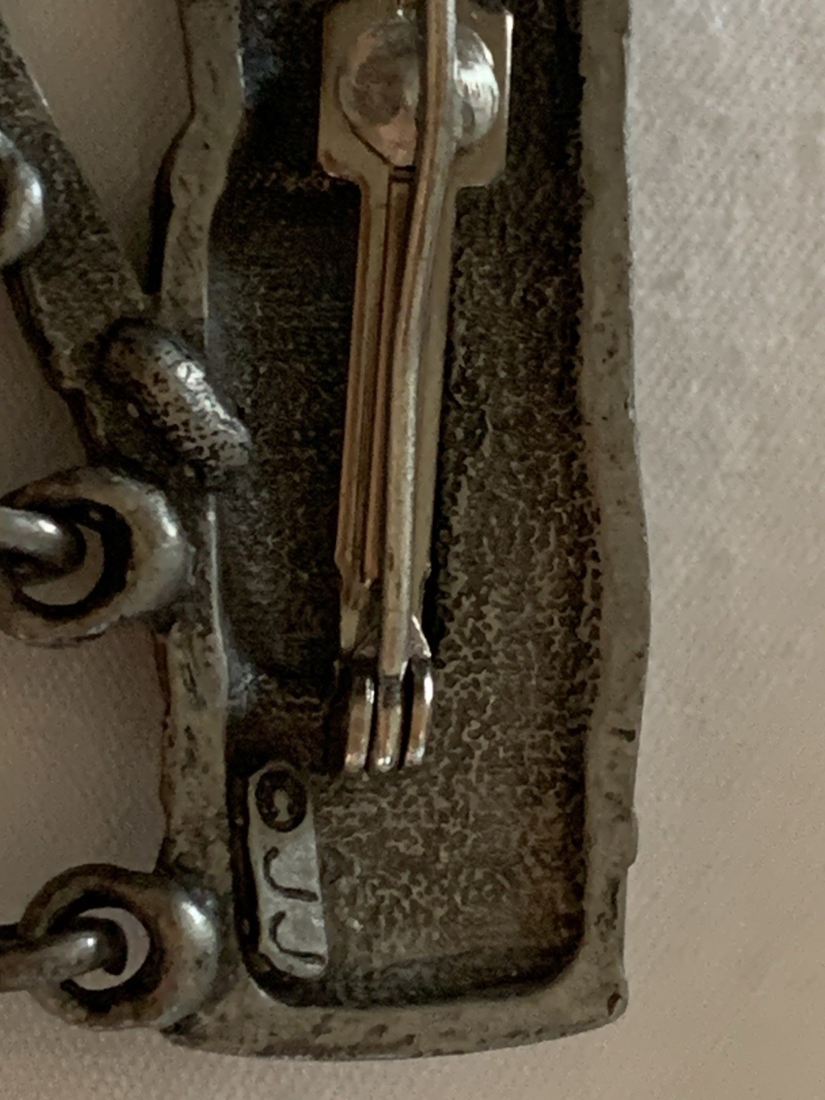 Jonette Jewelry (JJ) golf-themed brooch made of pewter or a similar alloy